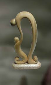 Wood sculpture of father and child